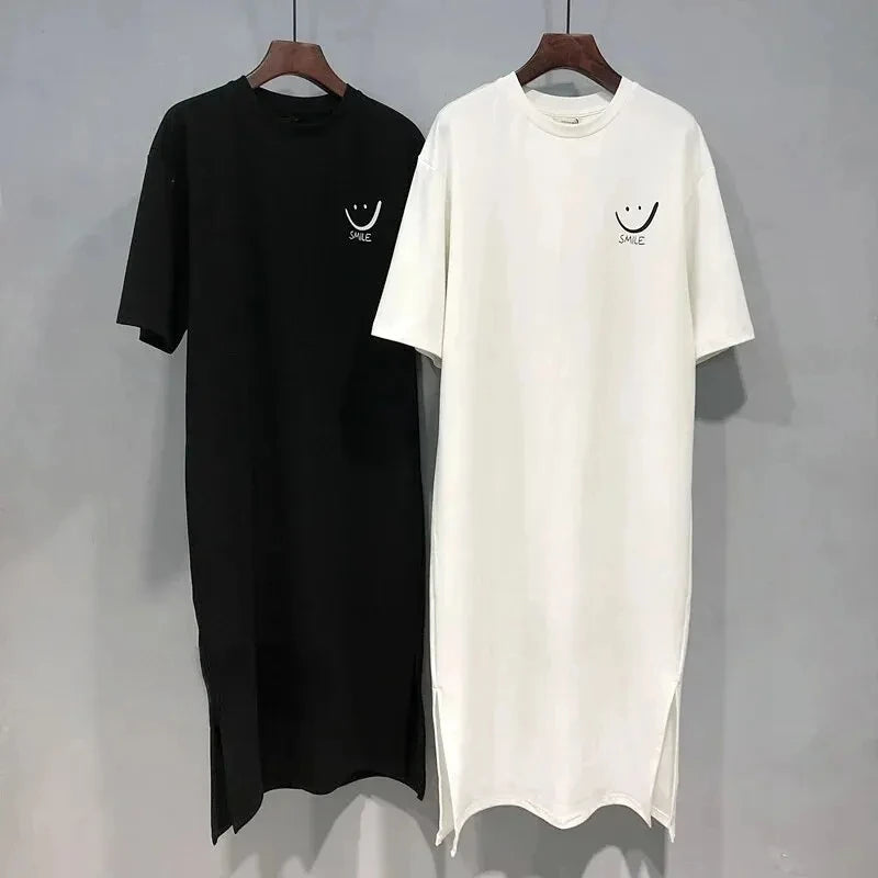 A trendy summer T‑shirt dress with a loose, mid‑length fit that falls elegantly over the knee. Designed with soft, breathable fabric and short sleeves for all‑day comfort. Perfect for casual outings, daily wear, and eff