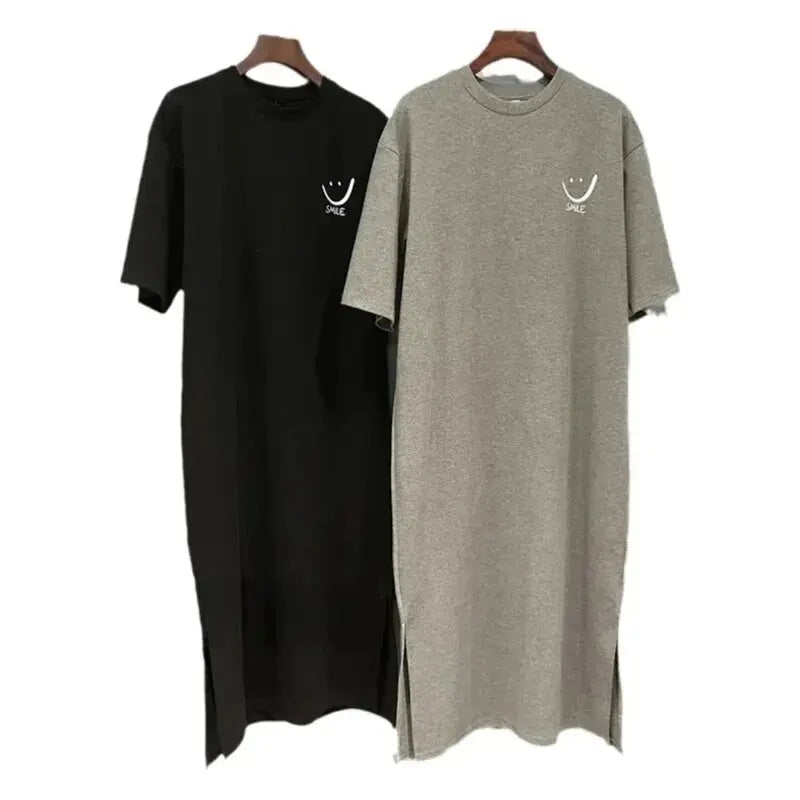 A trendy summer T‑shirt dress with a loose, mid‑length fit that falls elegantly over the knee. Designed with soft, breathable fabric and short sleeves for all‑day comfort. Perfect for casual outings, daily wear, and eff