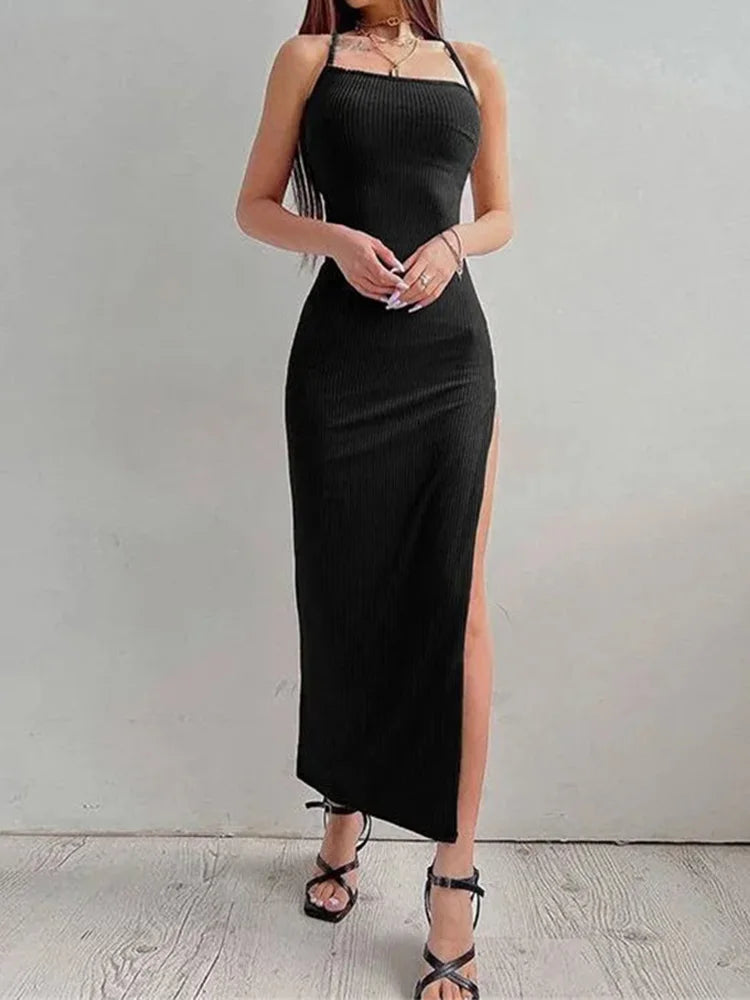 A sexy summer bodycon dress featuring a sleek halter neck, open‑back design, and high side split. Made with a soft, stretchy fabric that highlights your curves for an elegant and confident look—perfect for nights out or s