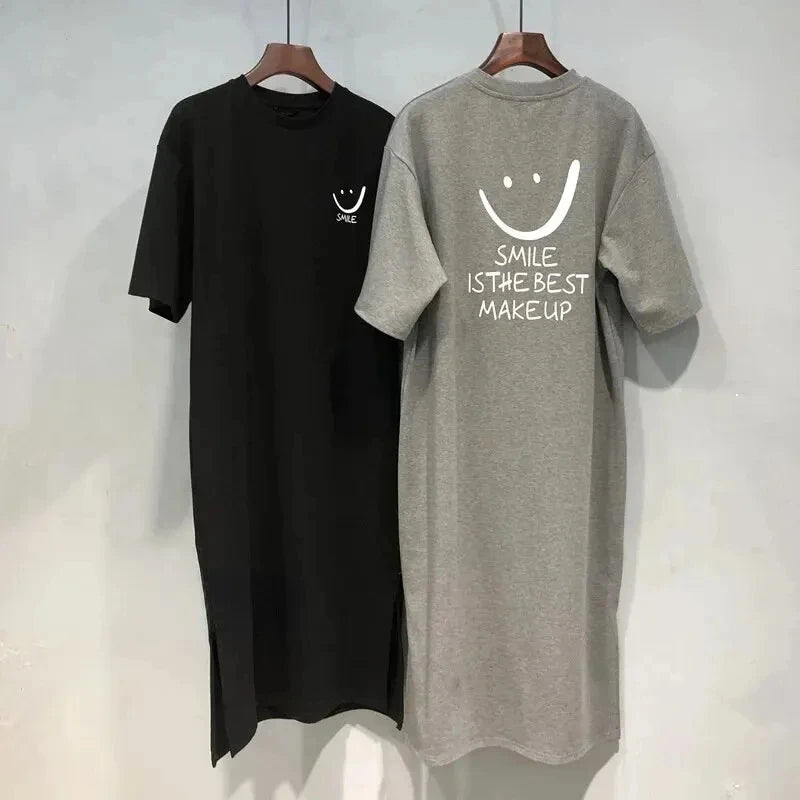 A trendy summer T‑shirt dress with a loose, mid‑length fit that falls elegantly over the knee. Designed with soft, breathable fabric and short sleeves for all‑day comfort. Perfect for casual outings, daily wear, and eff