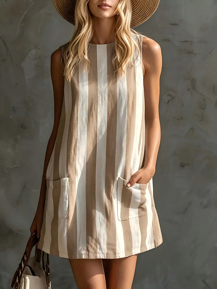 A stylish sleeveless mini dress featuring retro striped prints, a comfy loose fit, and a practical side pocket. Perfect for summer outings, holidays, and casual everyday wear with a relaxed, effortless vibe